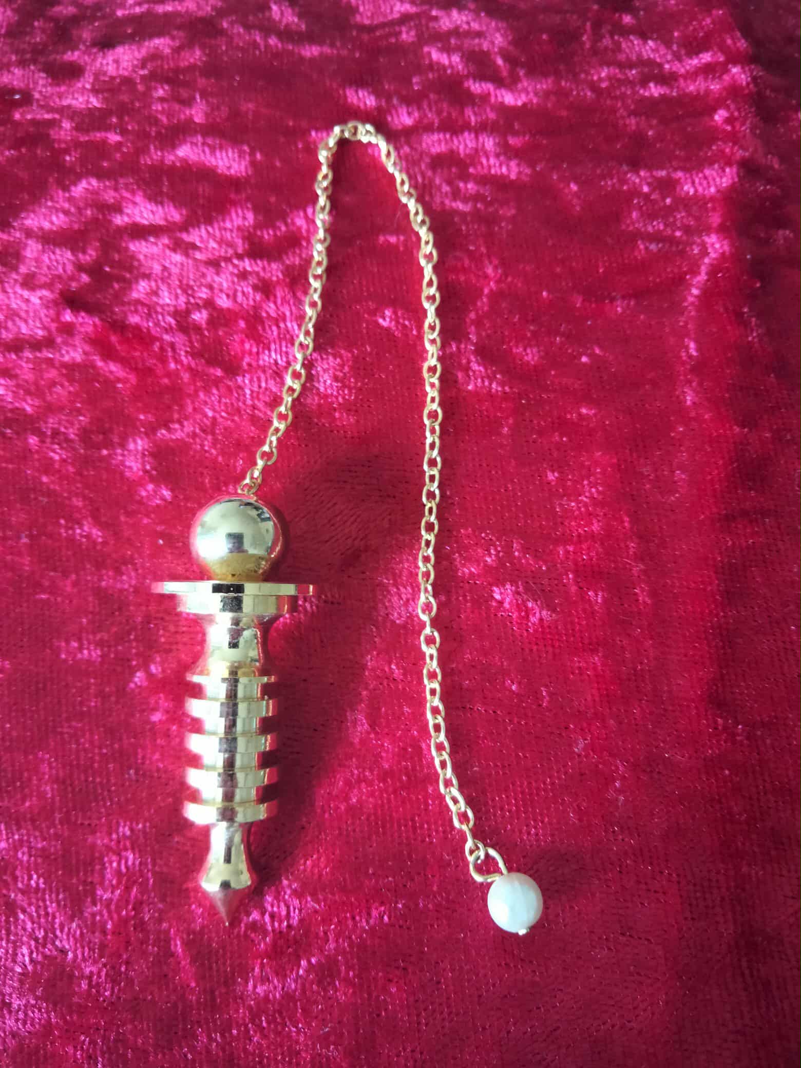 Pendule fleur de vie en laiton plaqué or